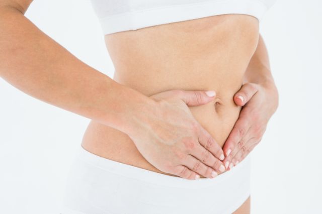 Fit woman with stomach pain